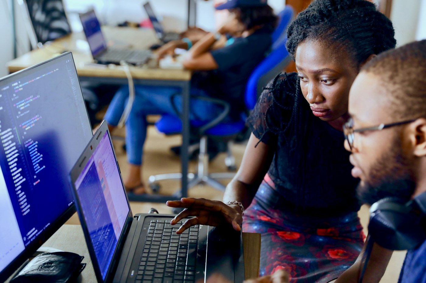 Young people working together at computers